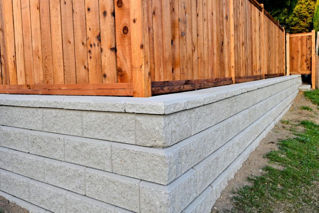 concrete sleeper retaining walls with timber fence