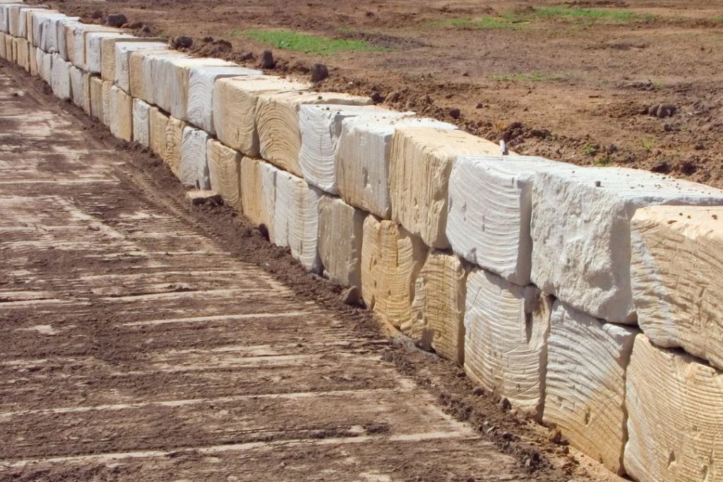 stone retaining wall holding up soil