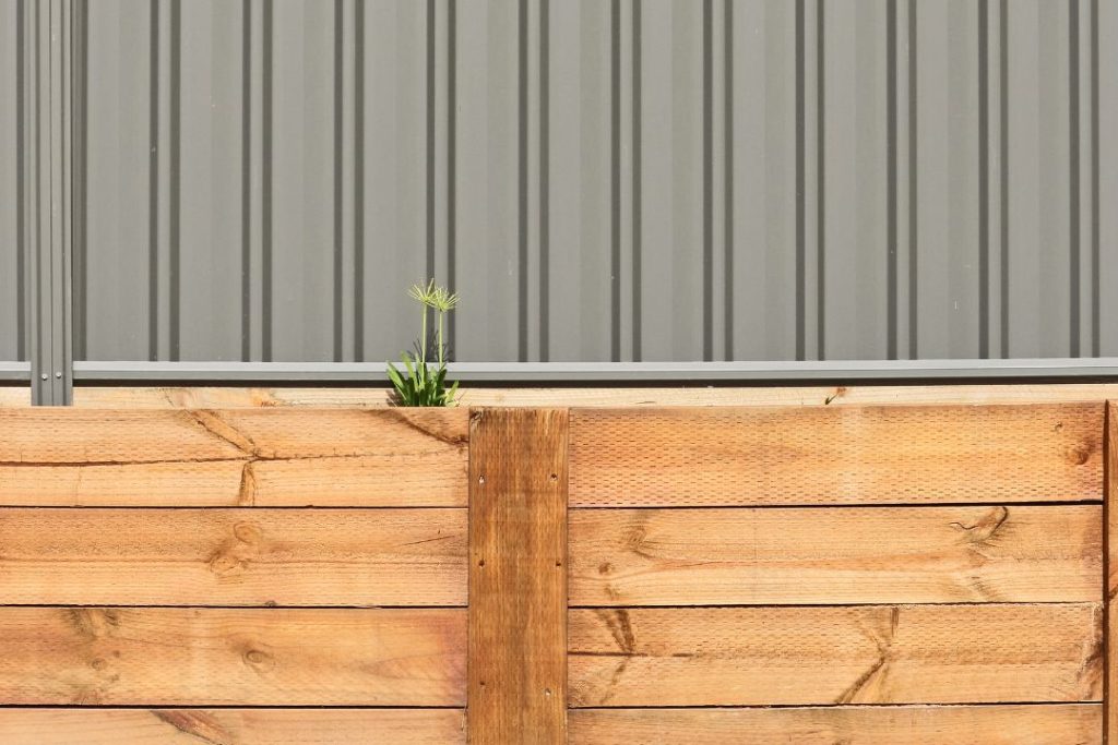 timber sleeper retaining walls with colorbond fence